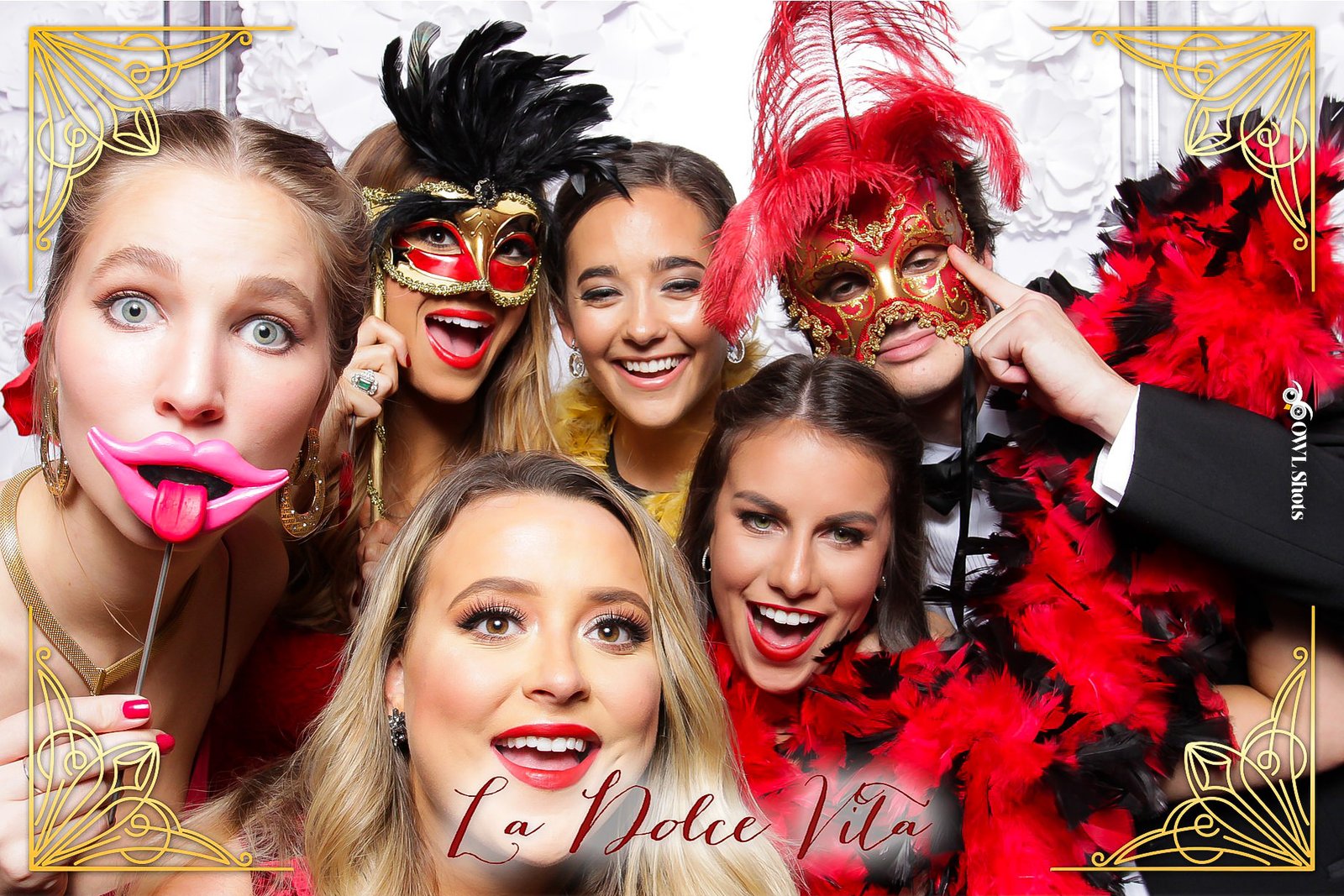Feathered masks and glam props at a 'La Dolce Vita' masquerade celebration